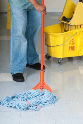 ABS Janitorial Services janitor in Baltimore, MD mopping floor.